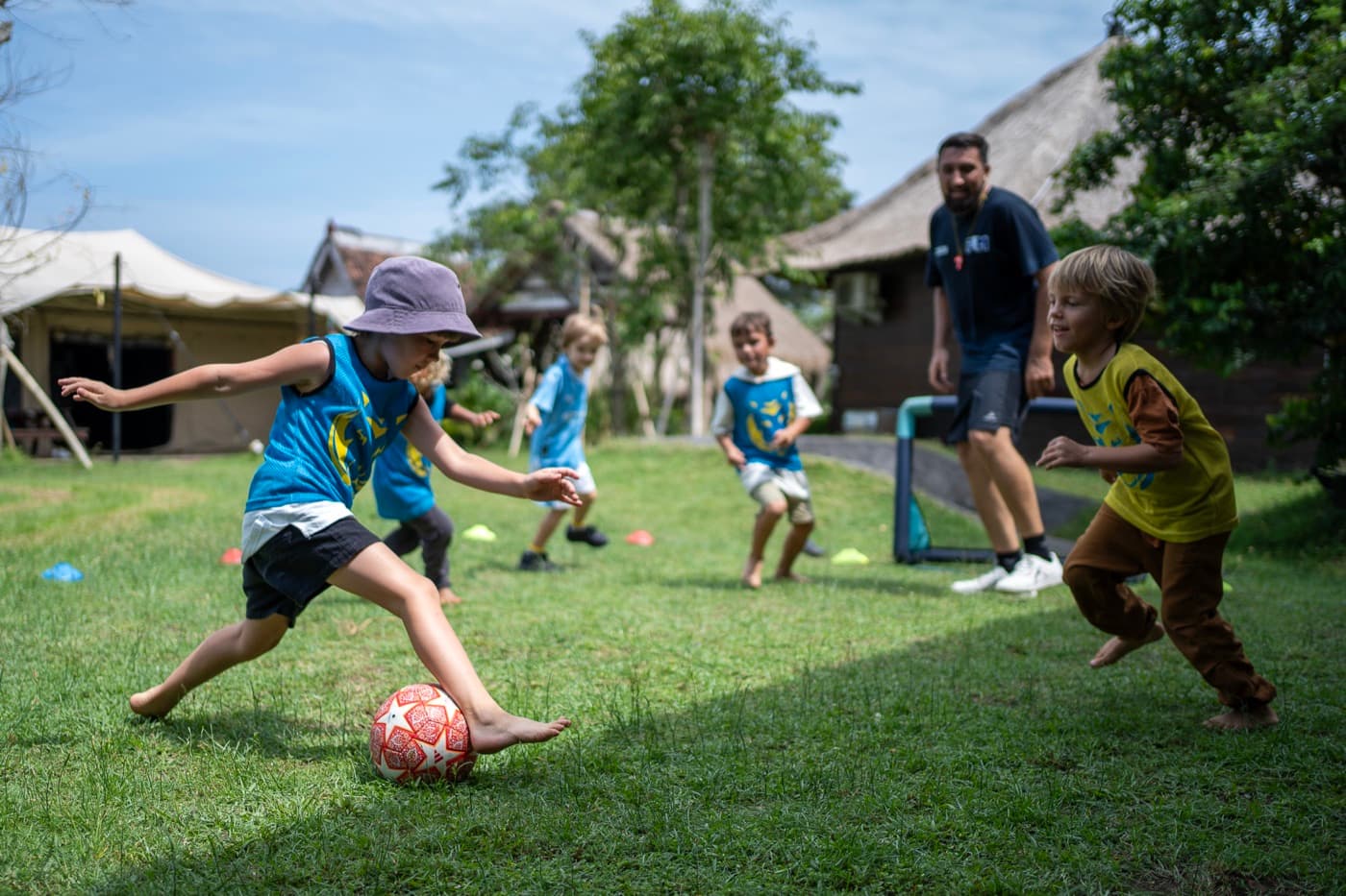 Kids playing football in the garden