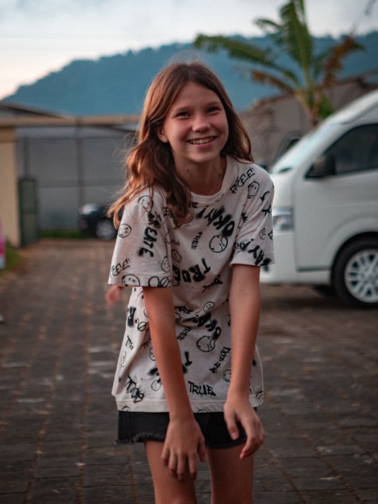 A happy child smiling at camp
