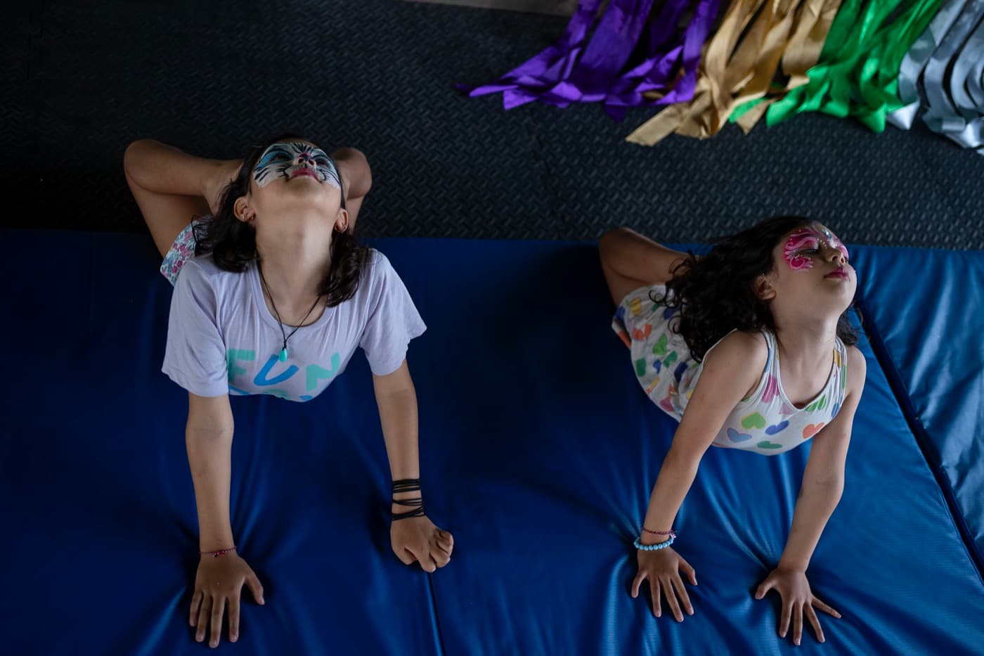 Kids stretching during a gymnastics class