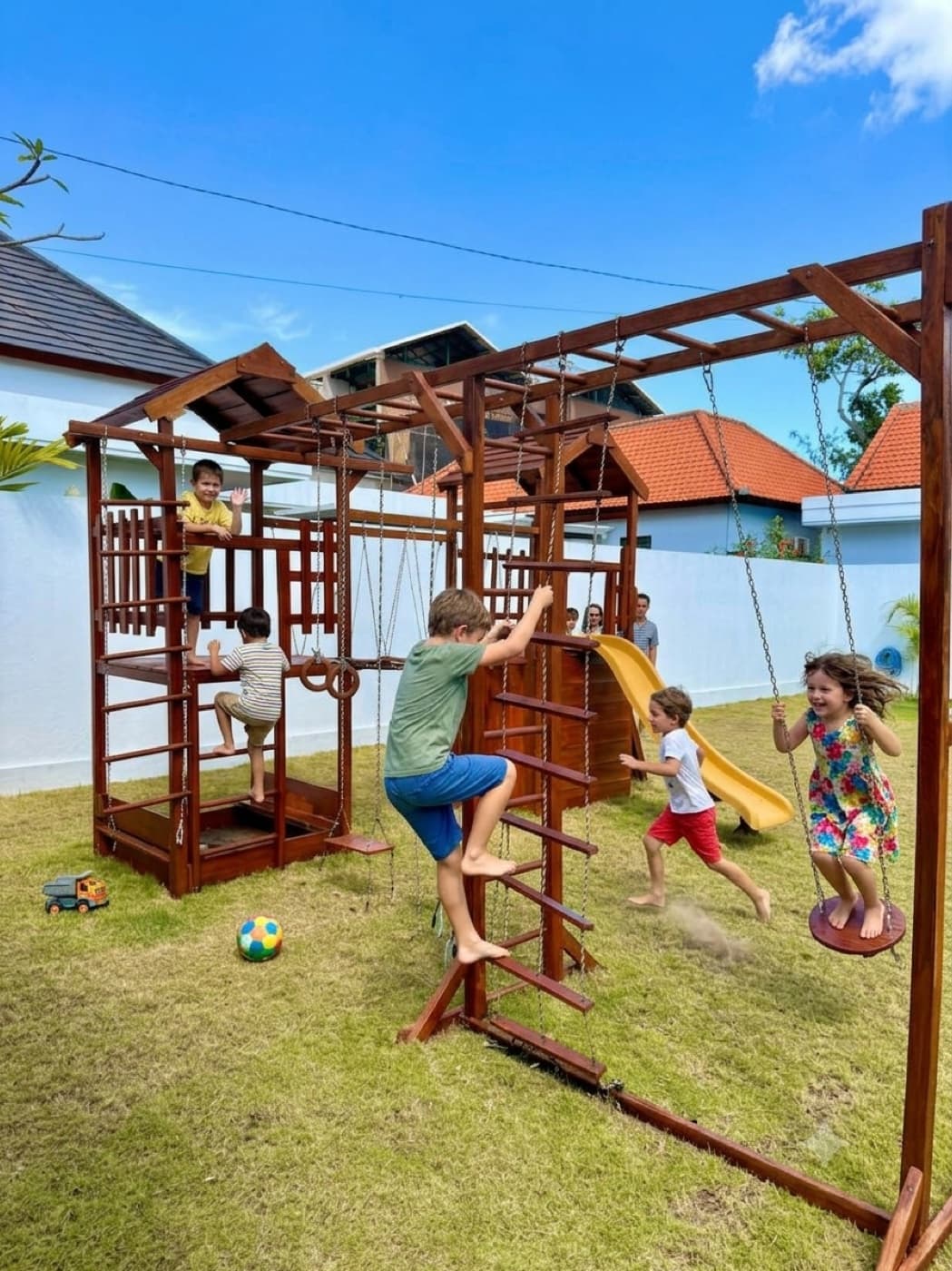 Kids on swings and climbing frames in the Jungle Kids garden